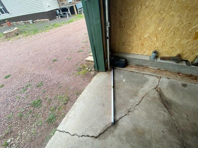 Leveled garage concrete floor stabilized with PolyLevel and sealed with NexusPro in Mellen WI