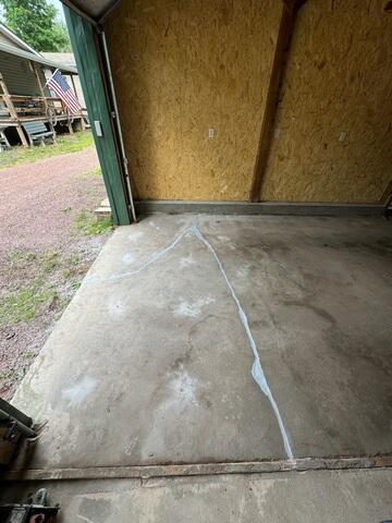 Sunken and cracked garage concrete floor slab before repair in Mellen WI