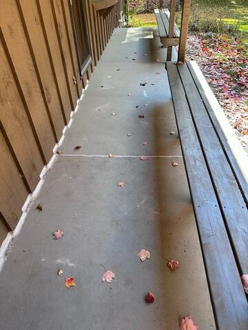 Perfectly leveled and repaired concrete walkway along a porch after PolyLevel injection in Osceola WI