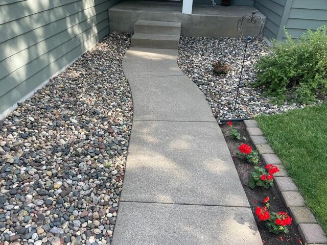 Completely level and clean concrete driveway and walkways after NexusPro sealing in Sauk Rapids MN