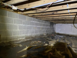 Wet crawl space before encapsulation in Winter, WI