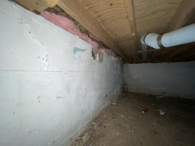 Clean foundation insulation installed along a stabilized crawl space wall network in Radisson Wisconsin