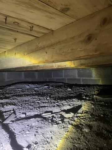 SmartJack heavy duty adjustable steel support system installed in a tight crawlspace in McGregor Minnesota
