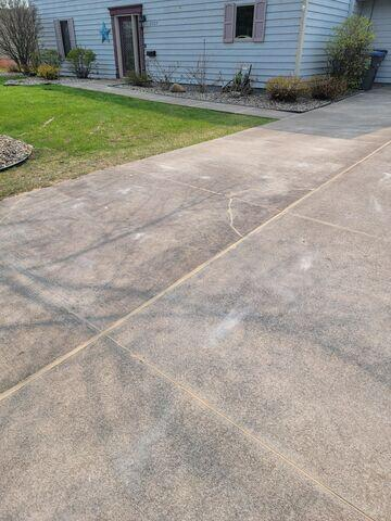 Leveled and fully restored concrete driveway with sealed expansion joints in Superior WI