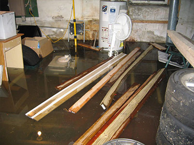 Flooded basement after heavy rain showing the need for basement waterproofing