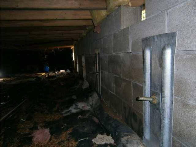 Completed foundation repair using wall anchors in a Cass Lake MN crawl space