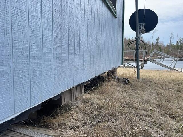 Exterior view of a settling cabin foundation in Grand Marais MN before repair