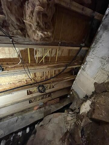 Sagging floor joists in a Grand Marais MN cabin crawl space requiring stabilization