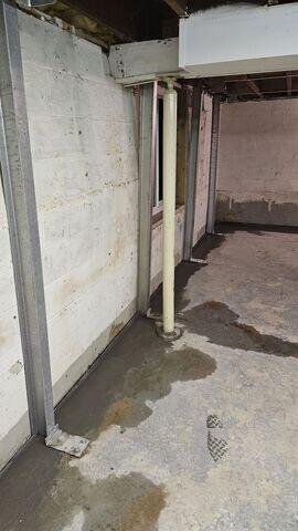 Completed foundation repair with PowerBraces and WaterGuard system in a Remer MN basement