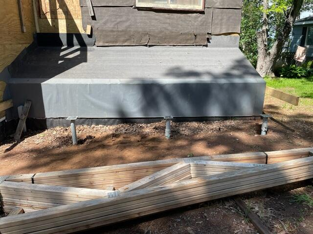 Three heavy duty helical deck pier brackets installed on new construction beams in Moose Lake Minnesota