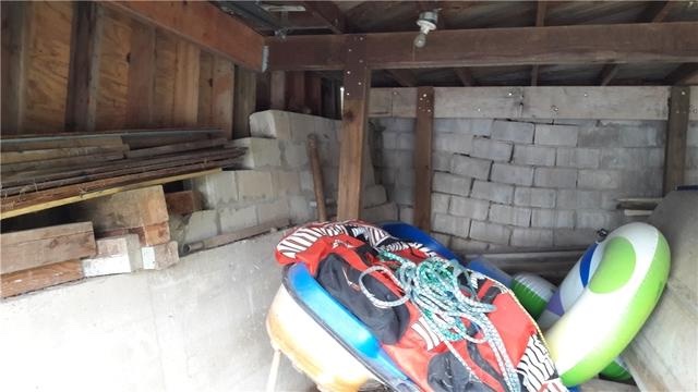 Unstable shifting masonry walls inside a McGregor Minnesota boathouse before foundation stabilization
